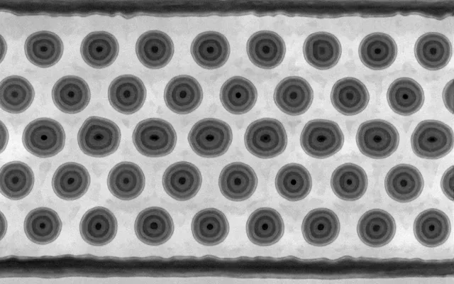 Top-down electron microscope image of a grid of 3D NAND memory channels